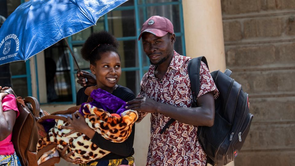 Mother and father carry newborn baby out of health facility_CHAMPS Video_CMMB_July2023