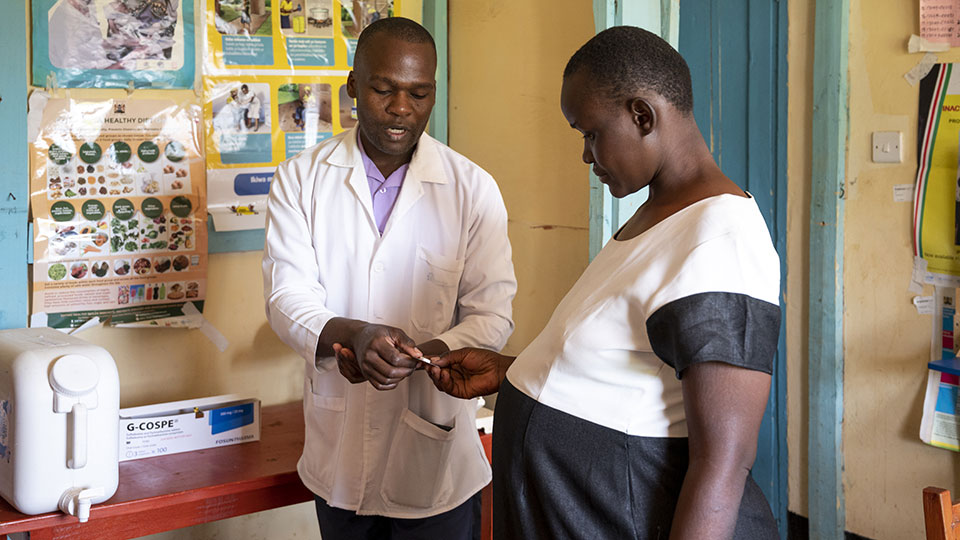 A pregnant woman receives care at a local hospital. She also receives knowledge on how to keep her children healthy as they grow.