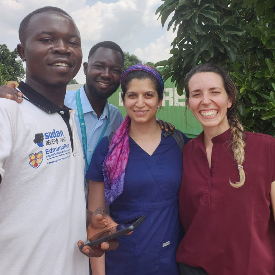 Ashley Munoz and Mahvash Majeed with hospital staff 