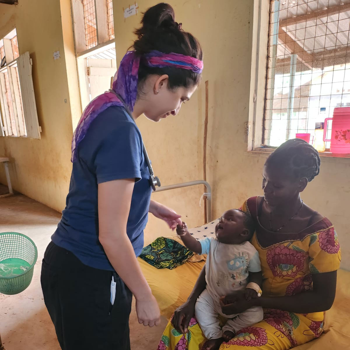 Dr. Mahvash attends to a mother a baby at St. Theresa hospital in Nzara, South Sudan