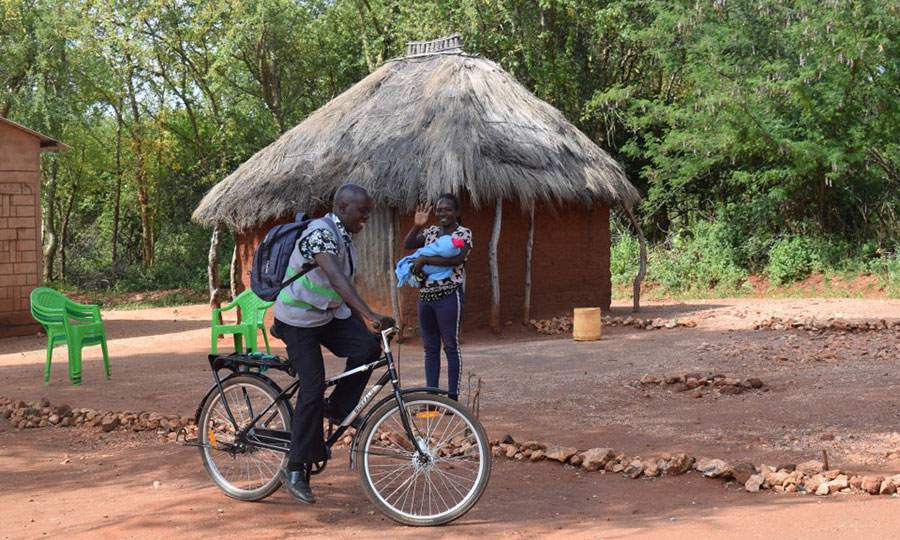 A CMMB-supported community health promoter rides his bike to deliver health and hope to homes.