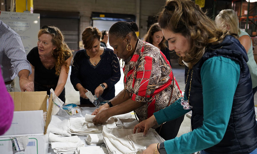 CMMB staff pack supplies for hurricane relief kits. Join us with prayers for those impacted by recent hurricanes.