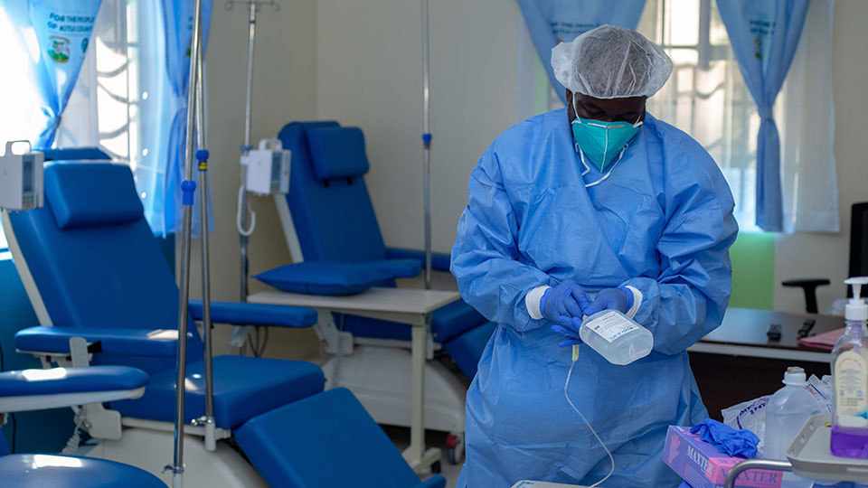 A doctor prepares to administer treatment at the Phangisile Mtshali Cancer Center.