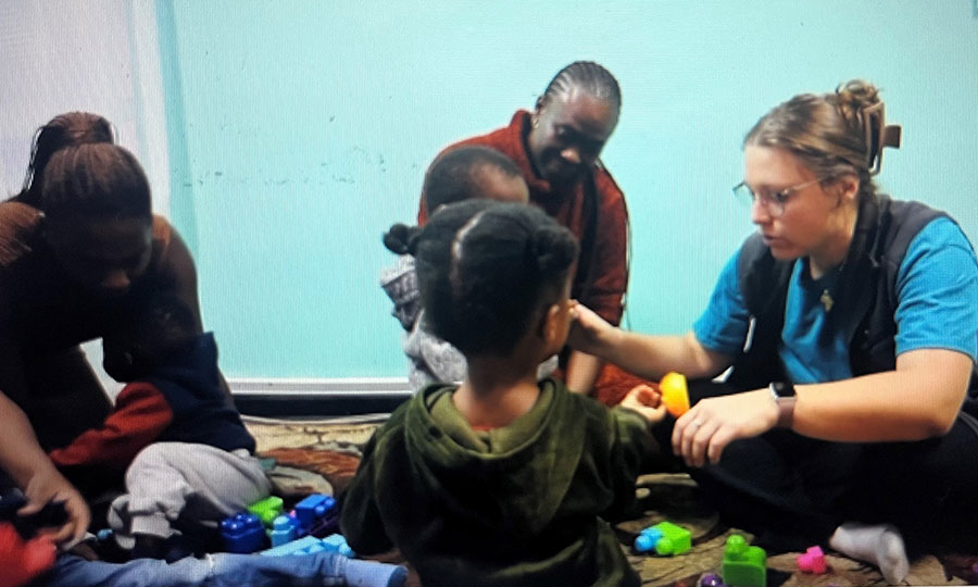 Abbey-with-patients-at-UTC-Clinic-Zambia Abbey, a CMMB Volunteer, with patients at the UTC Hospital. She engages patients in speech therapy.