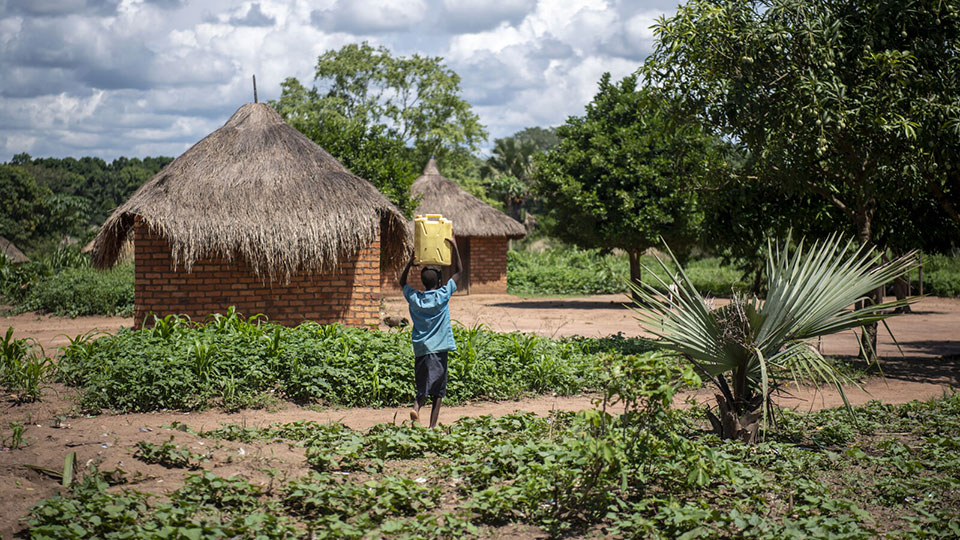 Child-carries-water-home-CMMB-South-Sudan A child carries water home. It is featured in a blogpost that shares updates on the growing crisis in South Sudan.