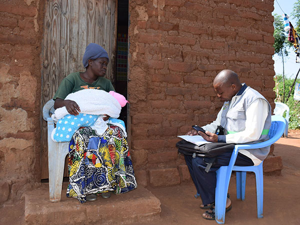 Joseph, a community health promoted, visits a mother and her newborn