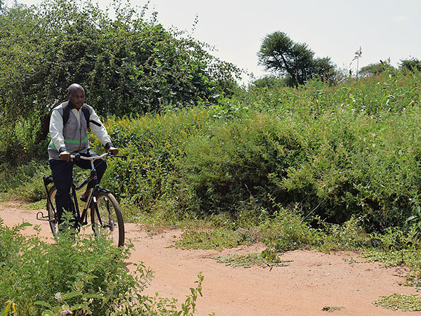 Joseph rides the rough terrain on his engineered Buffalo Bike.