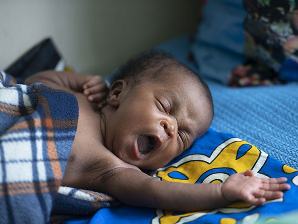 kangaroo-mother-care-CMMB-Kenya A newborn baby sleeps peacefully. In this article, we reflect Catholic Social Teaching and our motivation to serve.