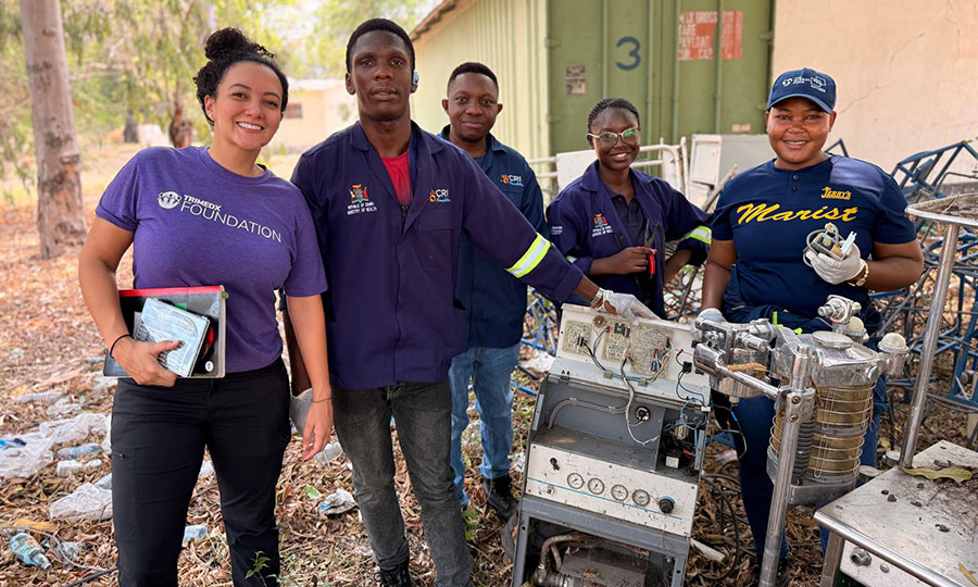 The TRIMEDX team with local engineers repair equipment at the Mwandi Mission Hospital.
