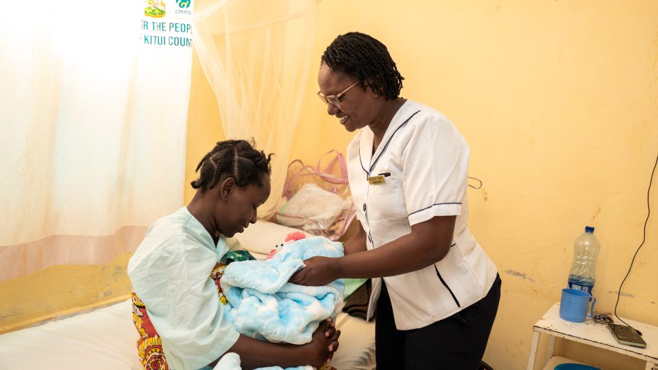 Nurse Miriam cares for a new mom at the Ikanga Level 4 Hospital.